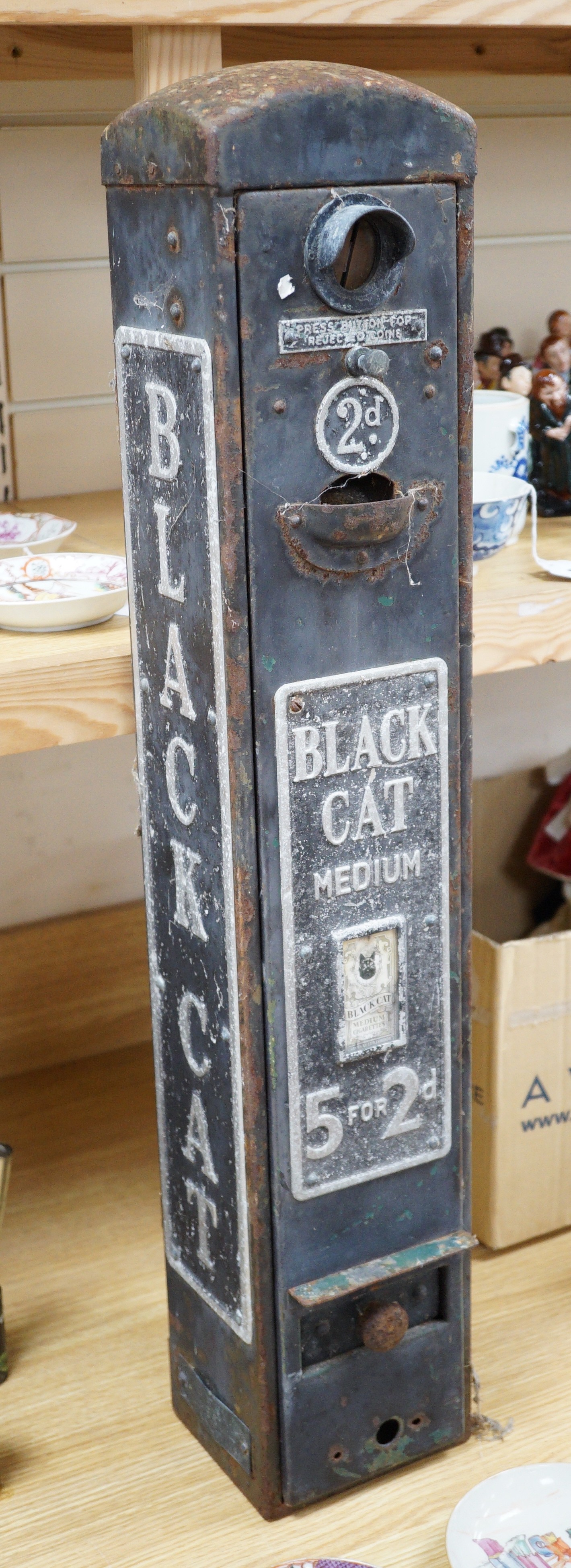 A Black Cat cigarette vending machine, 76cm